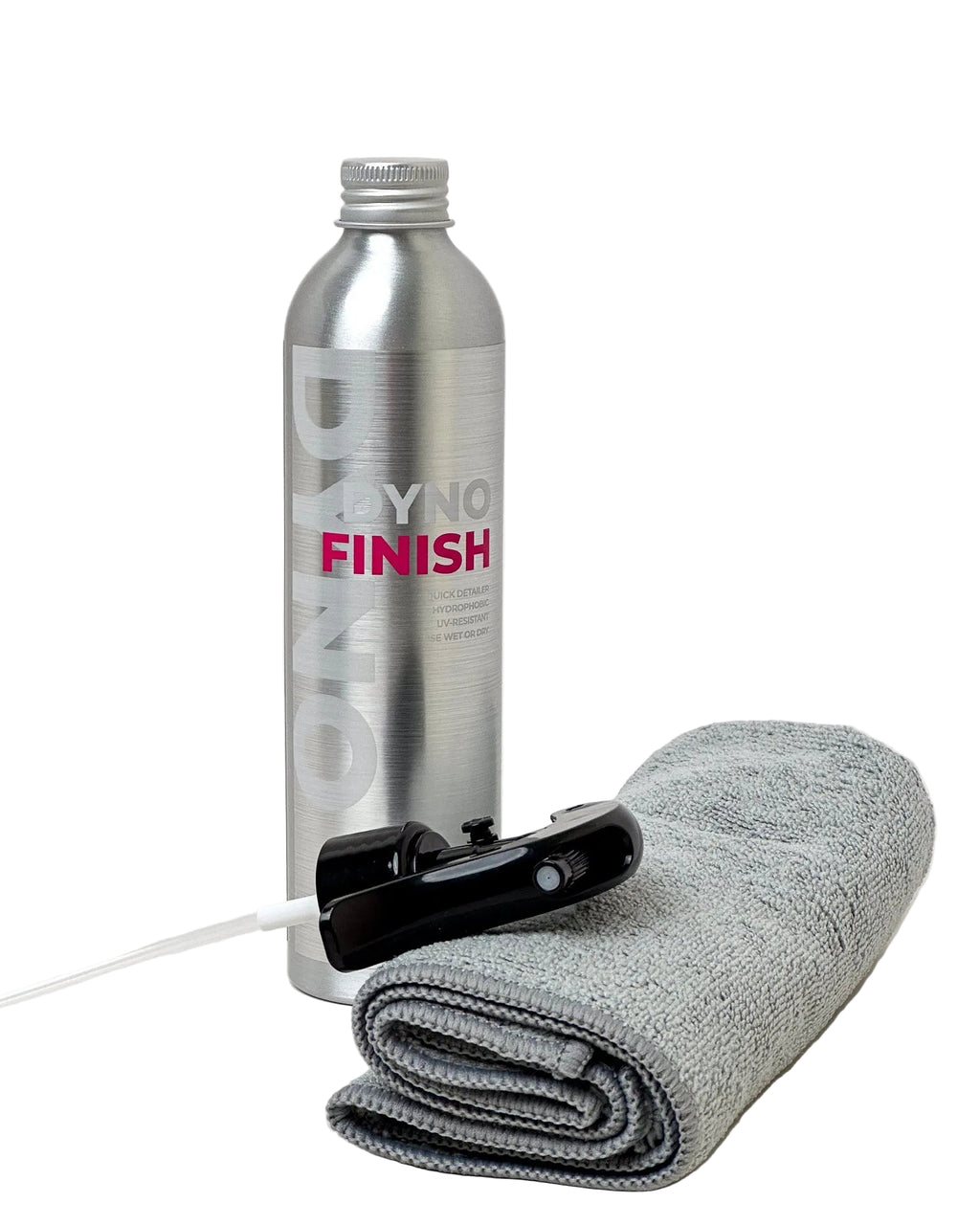 Silver bottle labeled 'DYNO Finish' with a gray towel, and black spray nozzle on a white background