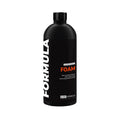 Black bottle of Formula Foam cleaning product on a white background