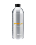Silver shampoo bottle with black cap on a white background
