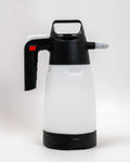 White spray bottle with black nozzle and handle on a white background
